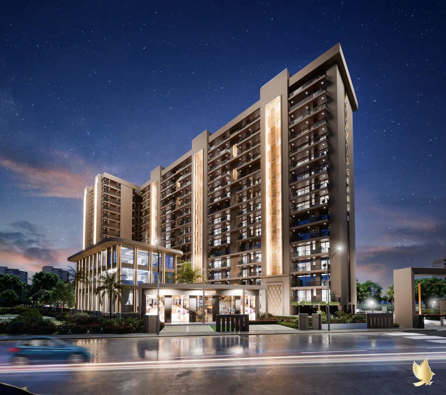 Night render of Atlantis Grand, Zirakpur, with the illuminated towers, lit clubhouse and entrance gate.