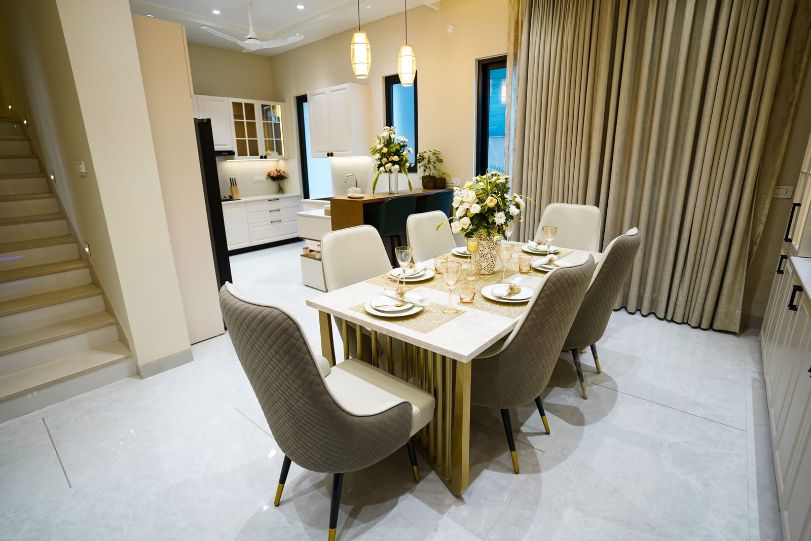 Photo of the dining area and staircase in the Highland Luxuria sample villa, Zirakpur