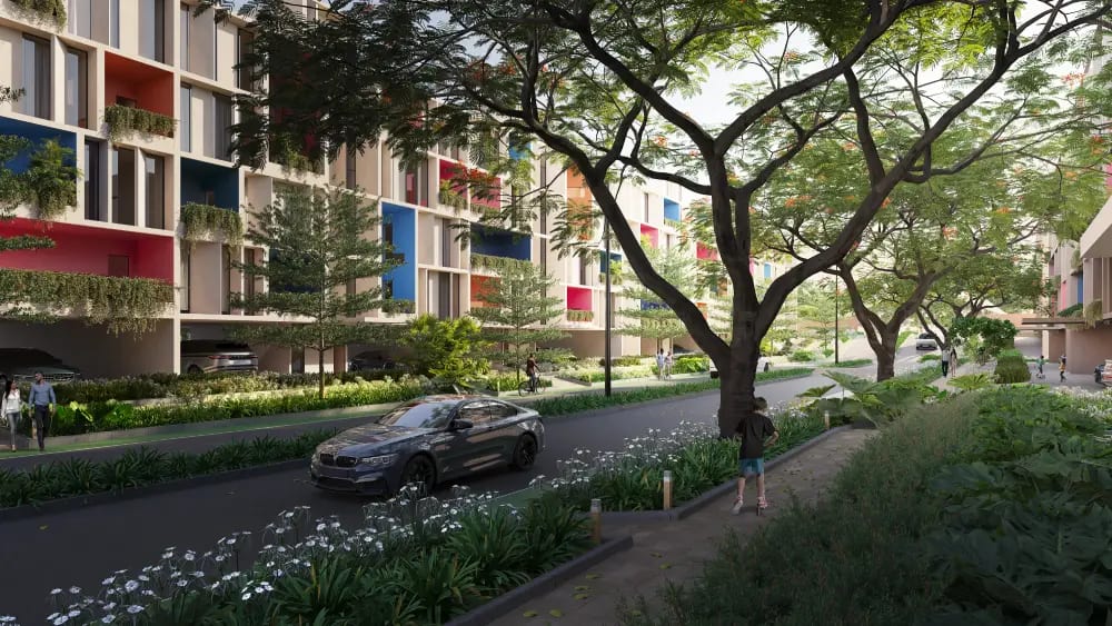 Render of a tree-lined internal road with landscaped verges and low-rise homes at The Wellness City, Rajpura.
