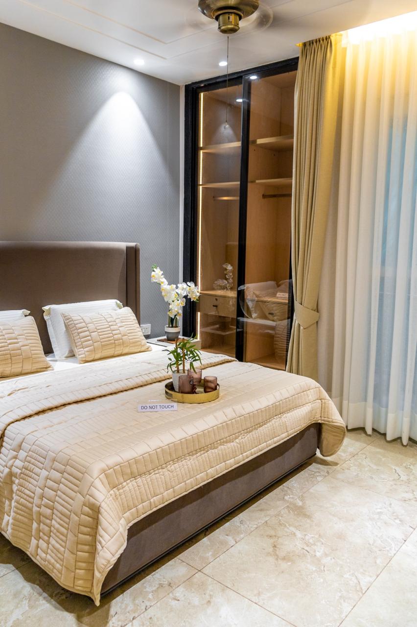 The Antares Zirakpur — master bedroom with wardrobe in the 3 BHK show flat